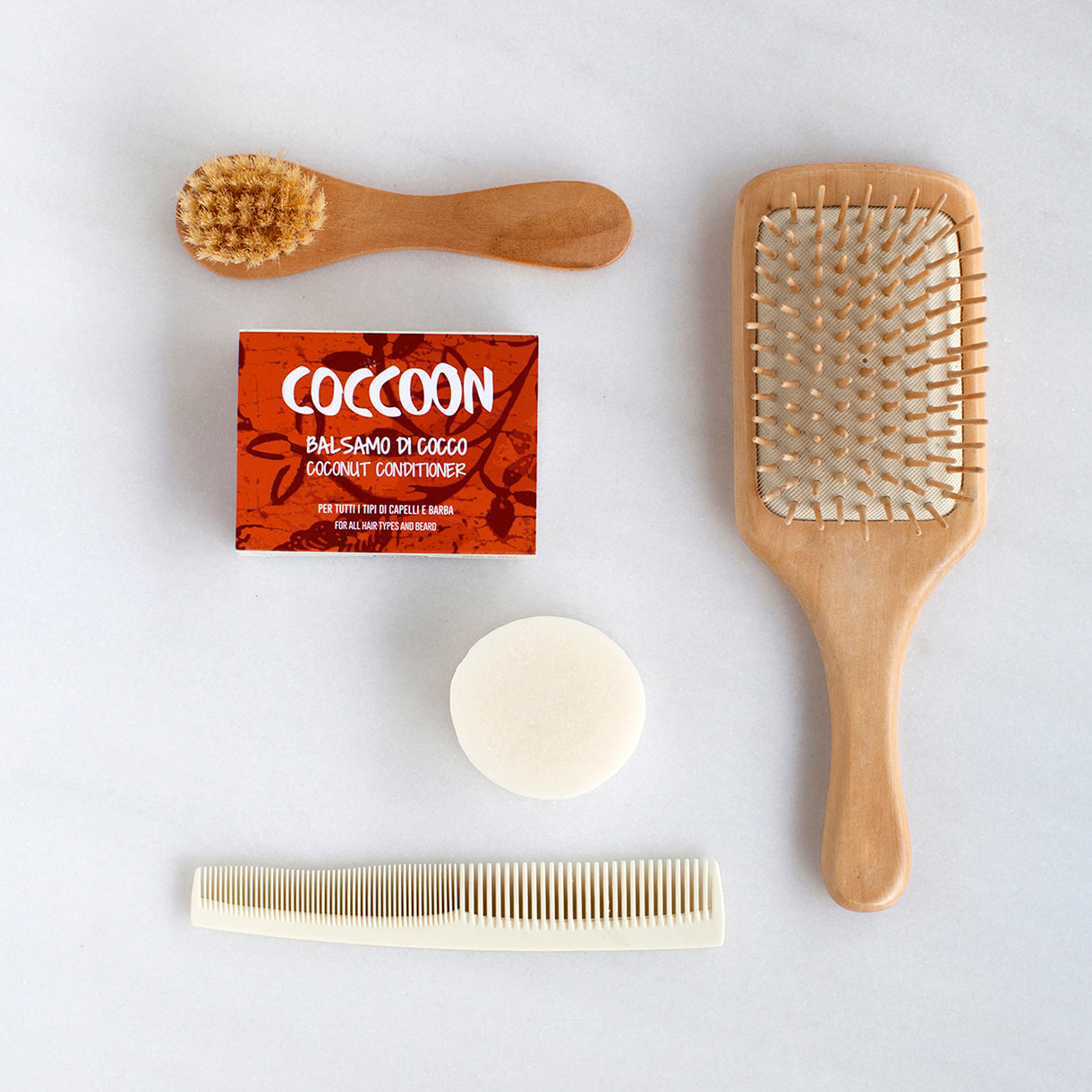 Confezione Balsamo di Cocco Coccoon con spazzole e pettini e panetto nudo